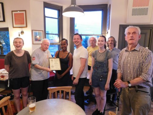 Les Maggs presents the certificate to Craig