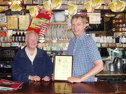 Branch Chairman Less Maggs (left) with landlord John King receiving the award.